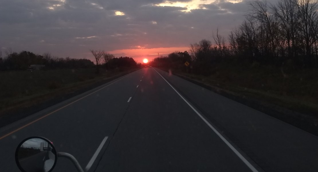 There is a sunrise lifting up from the road for our new day.